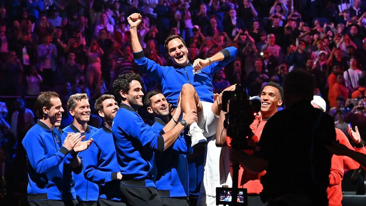 Switzerland's Roger Federer is given the bumps by teammates after playing his final match, a doubles with Spain's Rafael Nadal of Team Europe against USA's Jack Sock and USA's Frances Tiafoe of Team World in the 2022 Laver Cup at the O2 Arena in London, early on September 24, 2022. - Roger Federer brings the curtain down on his spectacular career in a "super special" match alongside long-time rival Rafael Nadal at the Laver Cup in London on Friday. - RESTRICTED TO EDITORIAL USE