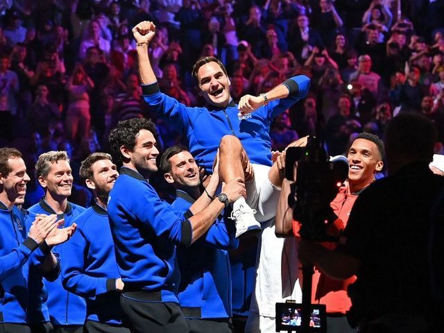 Switzerland's Roger Federer is given the bumps by teammates after playing his final match, a doubles with Spain's Rafael Nadal of Team Europe against USA's Jack Sock and USA's Frances Tiafoe of Team World in the 2022 Laver Cup at the O2 Arena in London, early on September 24, 2022. - Roger Federer brings the curtain down on his spectacular career in a "super special" match alongside long-time rival Rafael Nadal at the Laver Cup in London on Friday. - RESTRICTED TO EDITORIAL USE