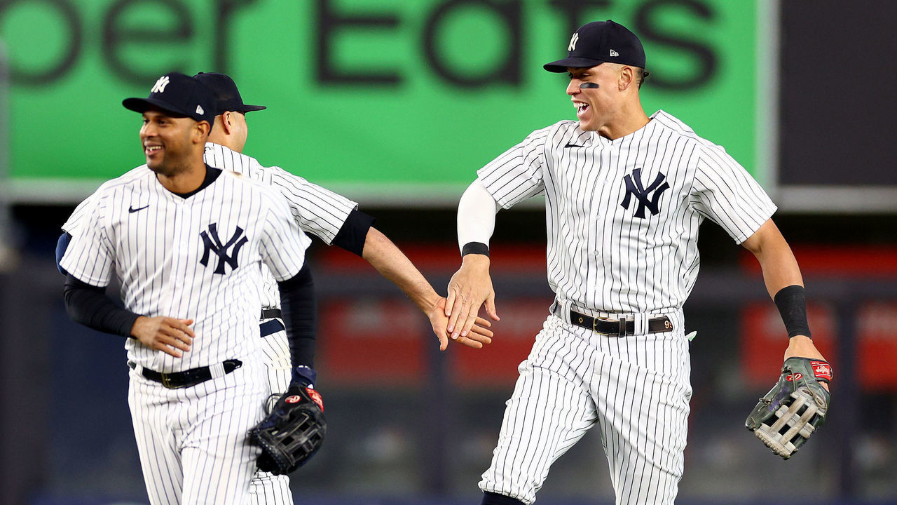 NEW YORK, NEW YORK - SEPTEMBER 23: Aaron Judge #99 of the New York Yankees celebrates the win with teammates Isiah Kiner-Falefa #12 and Aaron Hicks #31 after the game against the Boston Red Sox at Yankee Stadium on September 23, 2022 in the Bronx borough of New York City. The New York Yankees defeated the Boston Red Sox 5-4.