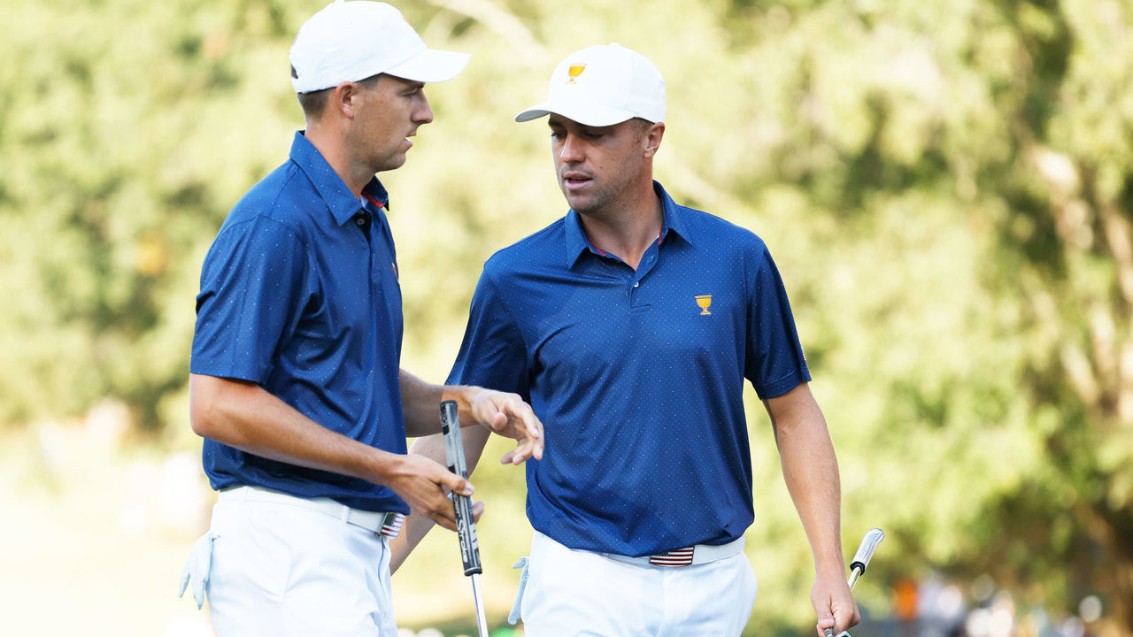 CHARLOTTE, NORTH CAROLINA - SEPTEMBER 24: (L-R) Jordan Spieth of the United States Team celebrates his putt to win the ninth hole with teammate Justin Thomas during Saturday morning foursomes on day three of the 2022 Presidents Cup at Quail Hollow Country Club on September 24, 2022 in Charlotte, North Carolina.