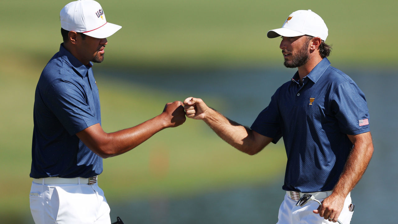 CHARLOTTE, NORTH CAROLINA - SEPTEMBER 24: (L-R) Tony Finau and Max Homa of the United States Team celebrate on the 13th green during Saturday morning foursomes on day three of the 2022 Presidents Cup at Quail Hollow Country Club on September 24, 2022 in Charlotte, North Carolina.