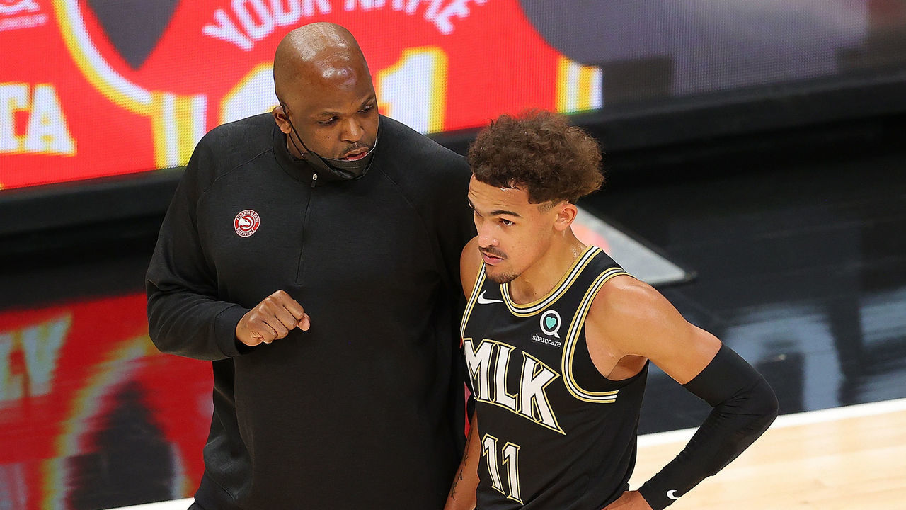 ATLANTA, GEORGIA - MAY 05: Head coach Nate McMillan of the Atlanta Hawks converses with Trae Young #11 during the first half against the Phoenix Suns at State Farm Arena on May 05, 2021 in Atlanta, Georgia.