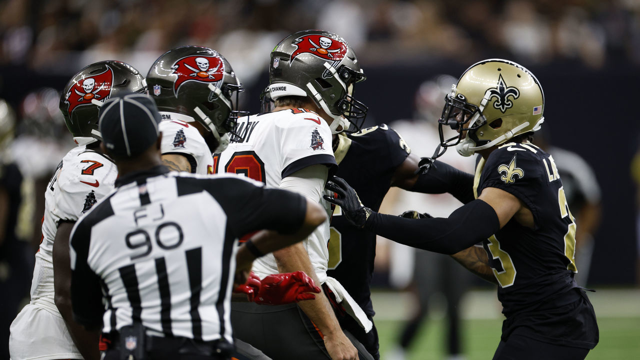 NEW ORLEANS, LOUISIANA - SEPTEMBER 18: Marshon Lattimore #23 of the New Orleans Saints pushes Leonard Fournette #7 of the Tampa Bay Buccaneers at Caesars Superdome on September 18, 2022 in New Orleans, Louisiana.