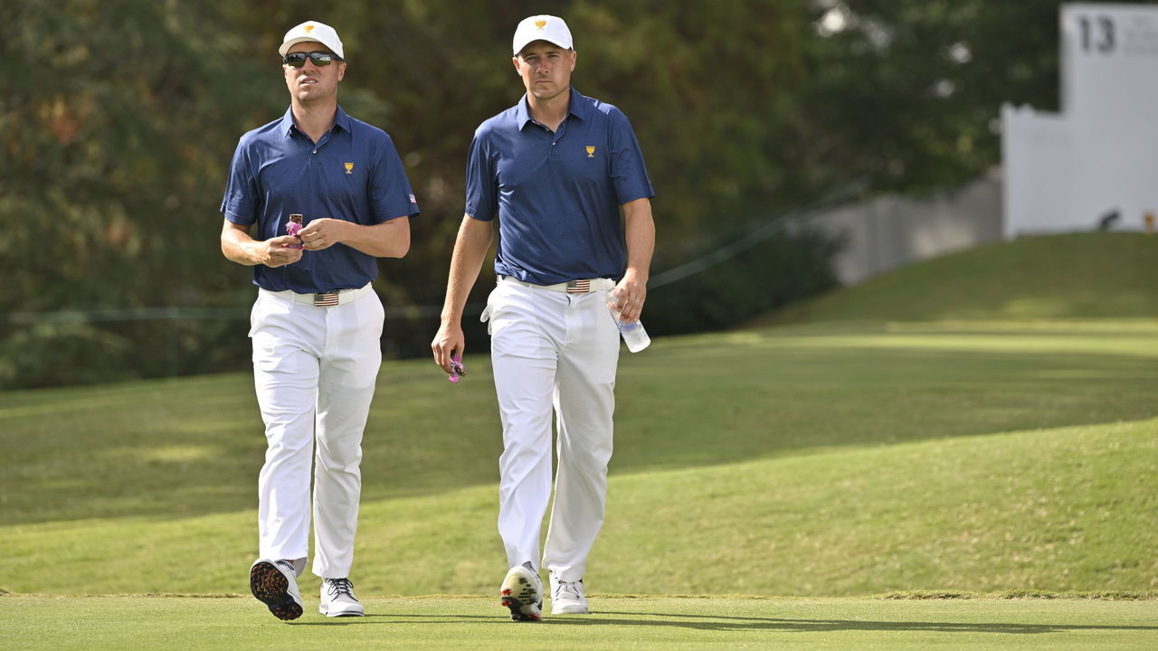 CHARLOTTE, NORTH CAROLINA - SEPTEMBER 24: U.S. Team players Justin Thomas and Jordan Spieth walk off the 13th hole tee box during Saturday afternoon Four-Ball Match Play of Presidents Cup at Quail Hollow September 24, 2022, in Charlotte, North Carolina.