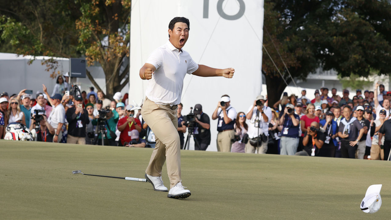CHARLOTTE, NC - SEPTEMBER 24: International Presidents Cup player Tom Kim reacts to making the winning putt of his match on the 18th hole during the 2022 Presidents Cup four-ball on September 24, 2022 at Quail Hollow Club in Charlotte, North Carolina.