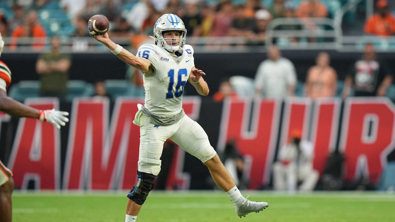MIAMI GARDENS, FL - SEPTEMBER 03: Middle Tennessee Blue Raiders quarterback Chase Cunningham (16) makes a throw on the run during the game between the Middle Tennessee Blue Raiders and the Miami Hurricanes on Saturday, September 24, 2022 at Hard Rock Stadium in Miami Gardens, FL