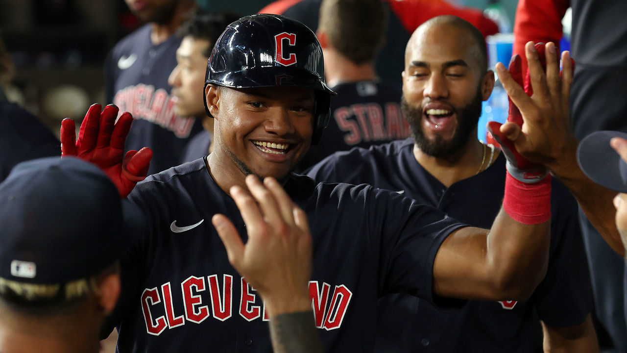 ARLINGTON, TEXAS - SEPTEMBER 24: Oscar Gonzalez #39 of the Cleveland Guardians is celebrated in the dugout after his second home run of the game against the Texas Rangers at Globe Life Field on September 24, 2022 in Arlington, Texas.