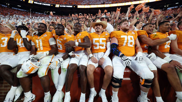 KNOXVILLE, TENNESSEE - SEPTEMBER 24: The Tennessee Volunteers team celebrates in the stands with the fans after a win against the Florida Gators at Neyland Stadium on September 24, 2022 in Knoxville, Tennessee. Tennessee won the game 38-33.