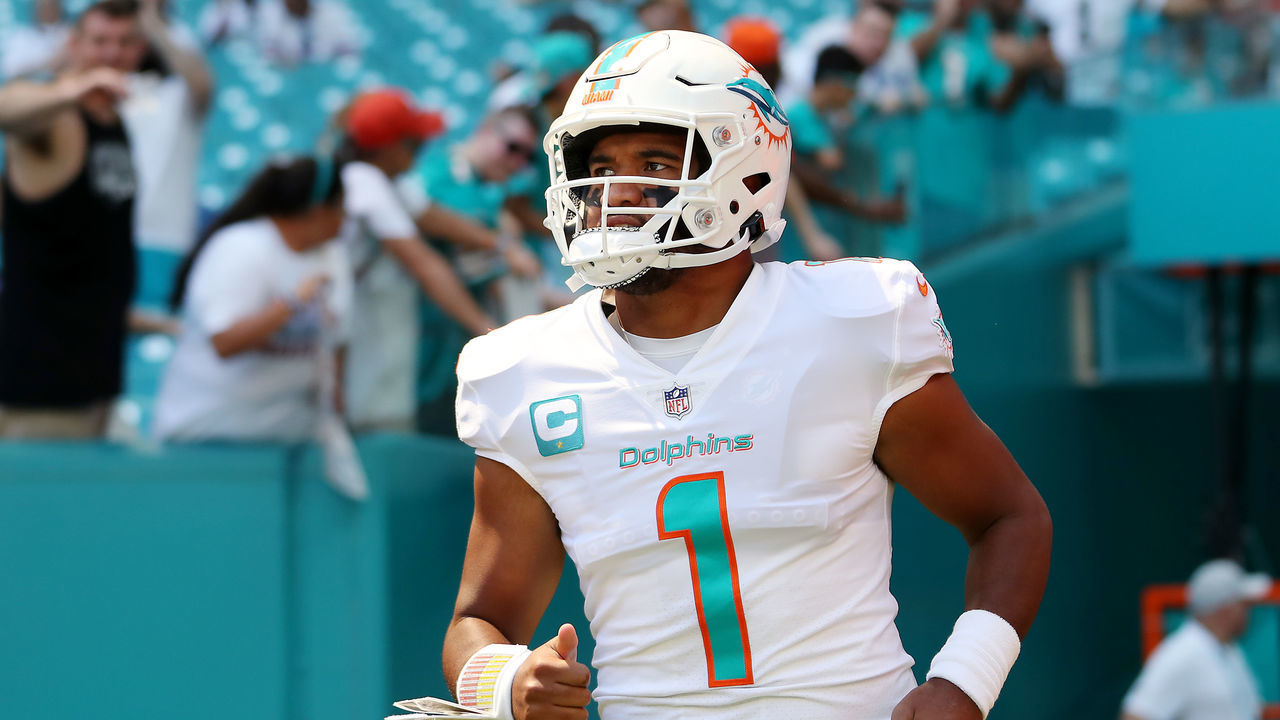 MIAMI GARDENS, FLORIDA - SEPTEMBER 25: Quarterback Tua Tagovailoa #1 of the Miami Dolphins runs onto the field before the game against the Buffalo Bills at Hard Rock Stadium on September 25, 2022 in Miami Gardens, Florida