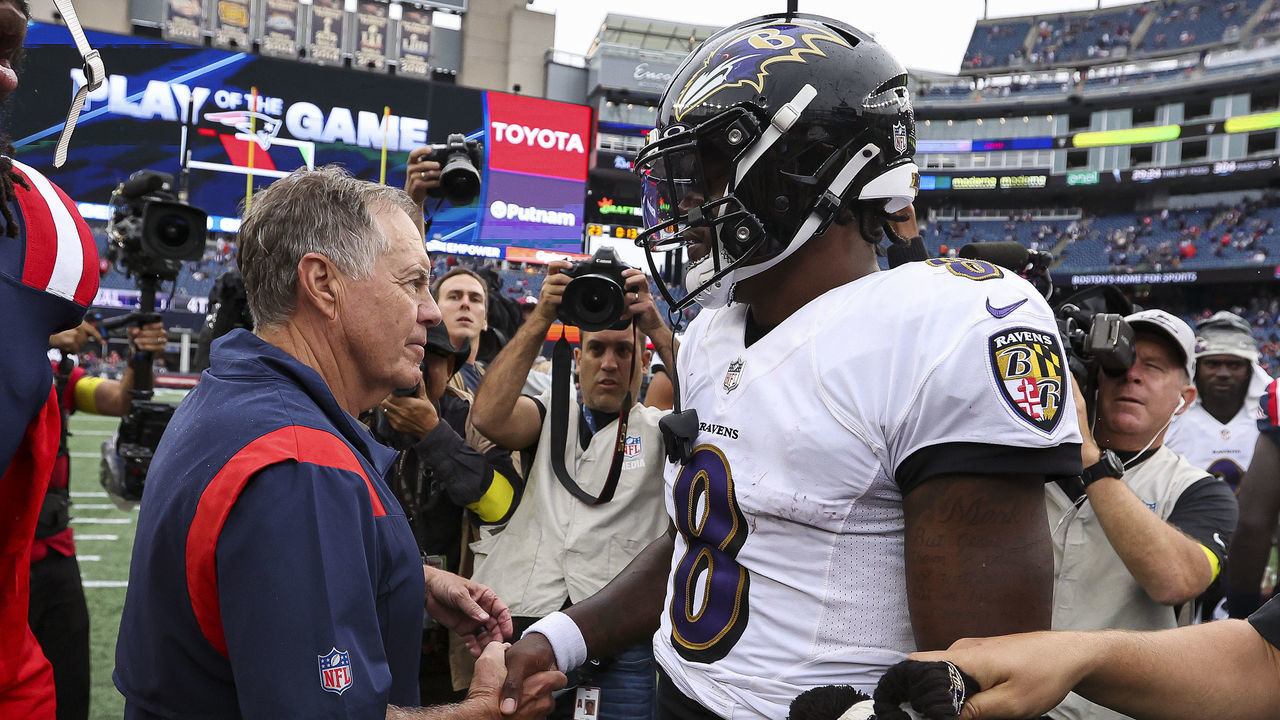 FOXBOROUGH, MASSACHUSETTS - SEPTEMBER 25: Head coach Bill Belichick of the New England Patriots shakes hands with quarterback Lamar Jackson #8 of the Baltimore Ravens after Baltimore's 37-26 win at Gillette Stadium on September 25, 2022 in Foxborough, Massachusetts.