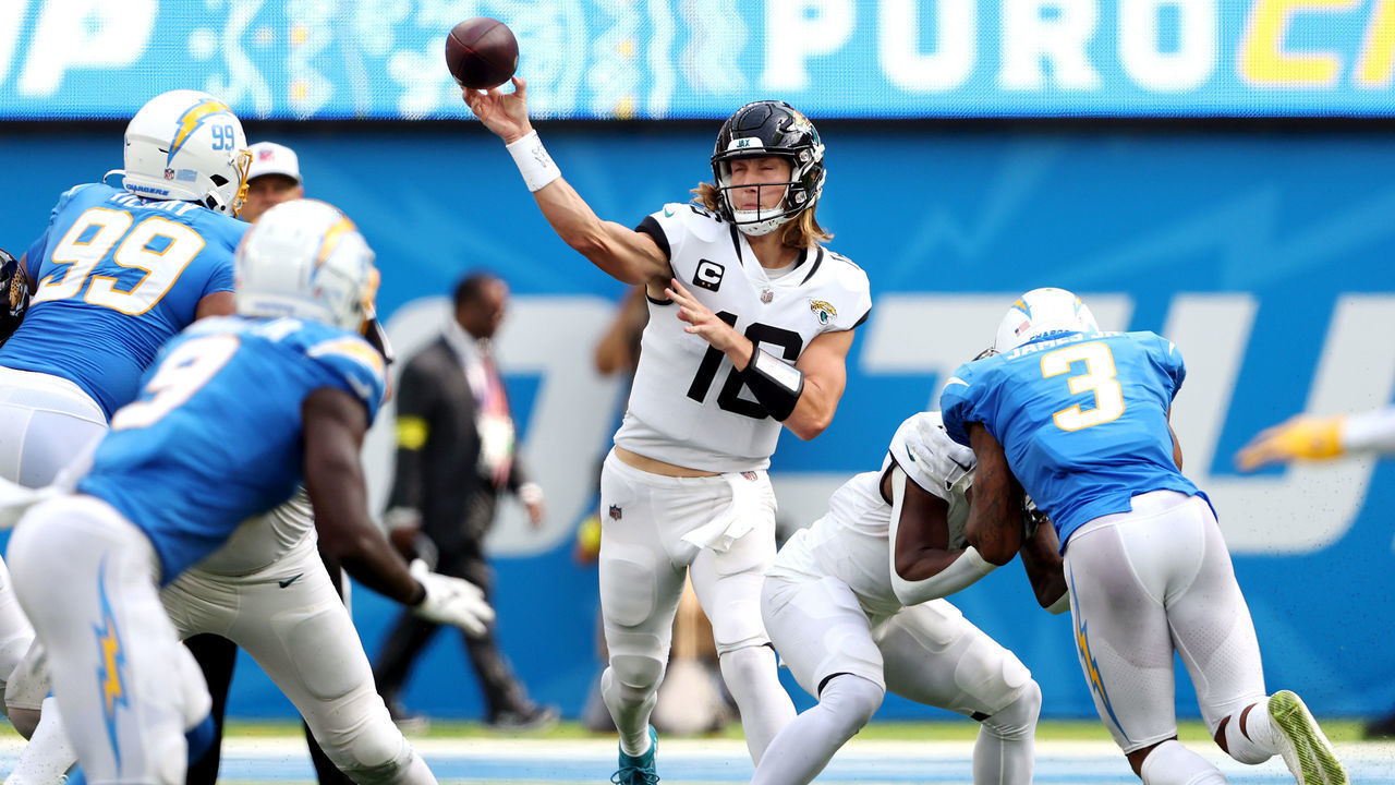 INGLEWOOD, CALIFORNIA - SEPTEMBER 25: Trevor Lawrence #16 of the Jacksonville Jaguars attempts a pass during the first half against the Los Angeles Chargers at SoFi Stadium on September 25, 2022 in Inglewood, California.