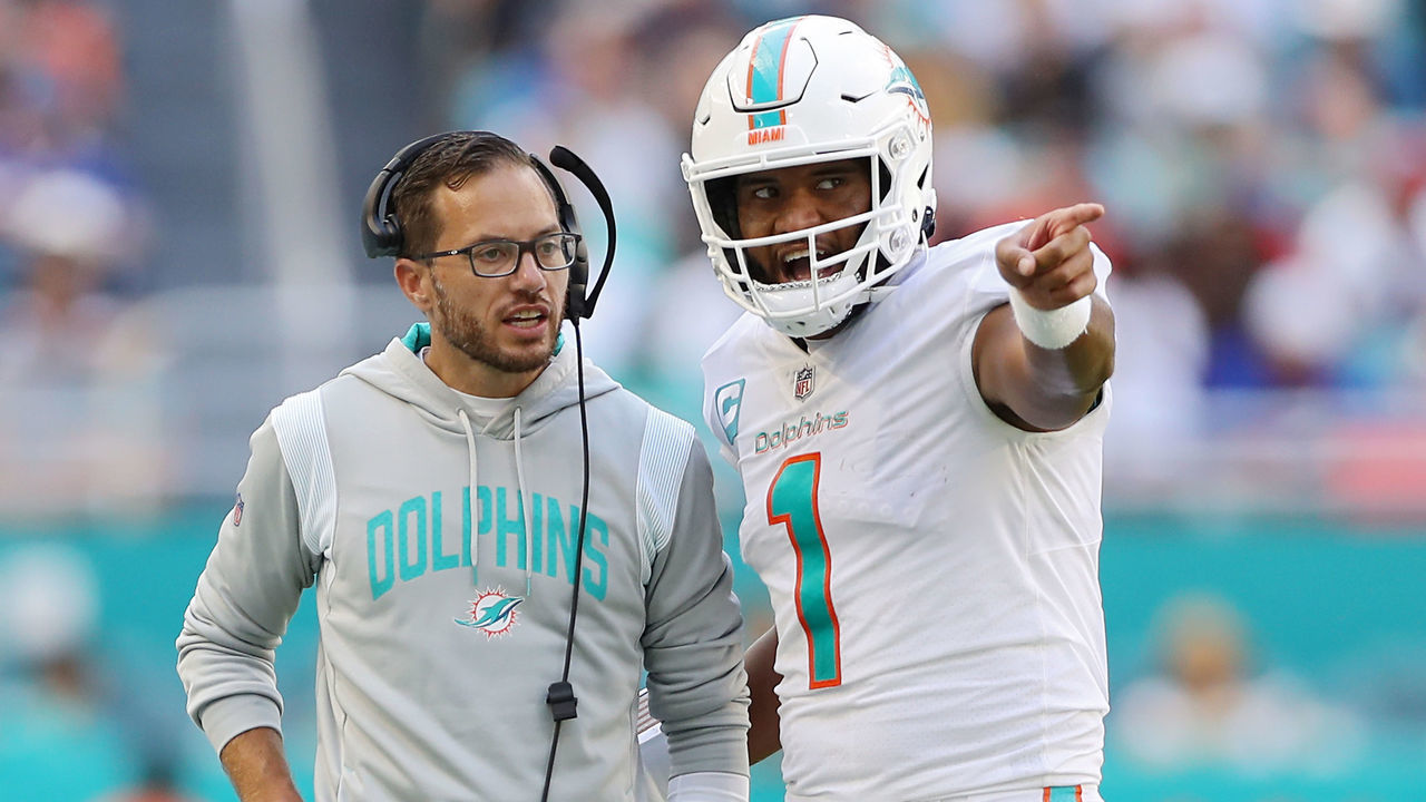 MIAMI GARDENS, FLORIDA - SEPTEMBER 25: Head coach Mike McDaniel speaks with quarterback Tua Tagovailoa #1 of the Miami Dolphins in the fourth quarter of the game against the Buffalo Bills at Hard Rock Stadium on September 25, 2022 in Miami Gardens, Florida.