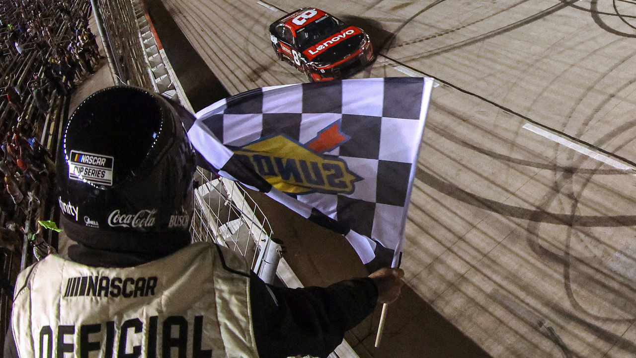 FORT WORTH, TEXAS - SEPTEMBER 25: Tyler Reddick, driver of the #8 Lenovo/ThinkEdge Chevrolet, takes the checkered flag to win the NASCAR Cup Series Auto Trader EchoPark Automotive 500 at Texas Motor Speedway on September 25, 2022 in Fort Worth, Texas.