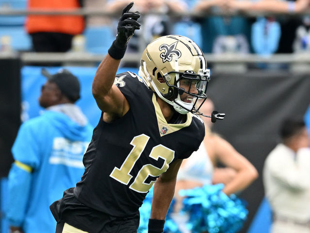 CHARLOTTE, NORTH CAROLINA - SEPTEMBER 25: Chris Olave #12 of the New Orleans Saints reacts after making a catch against the Carolina Panthers during the second quarter at Bank of America Stadium on September 25, 2022 in Charlotte, North Carolina.