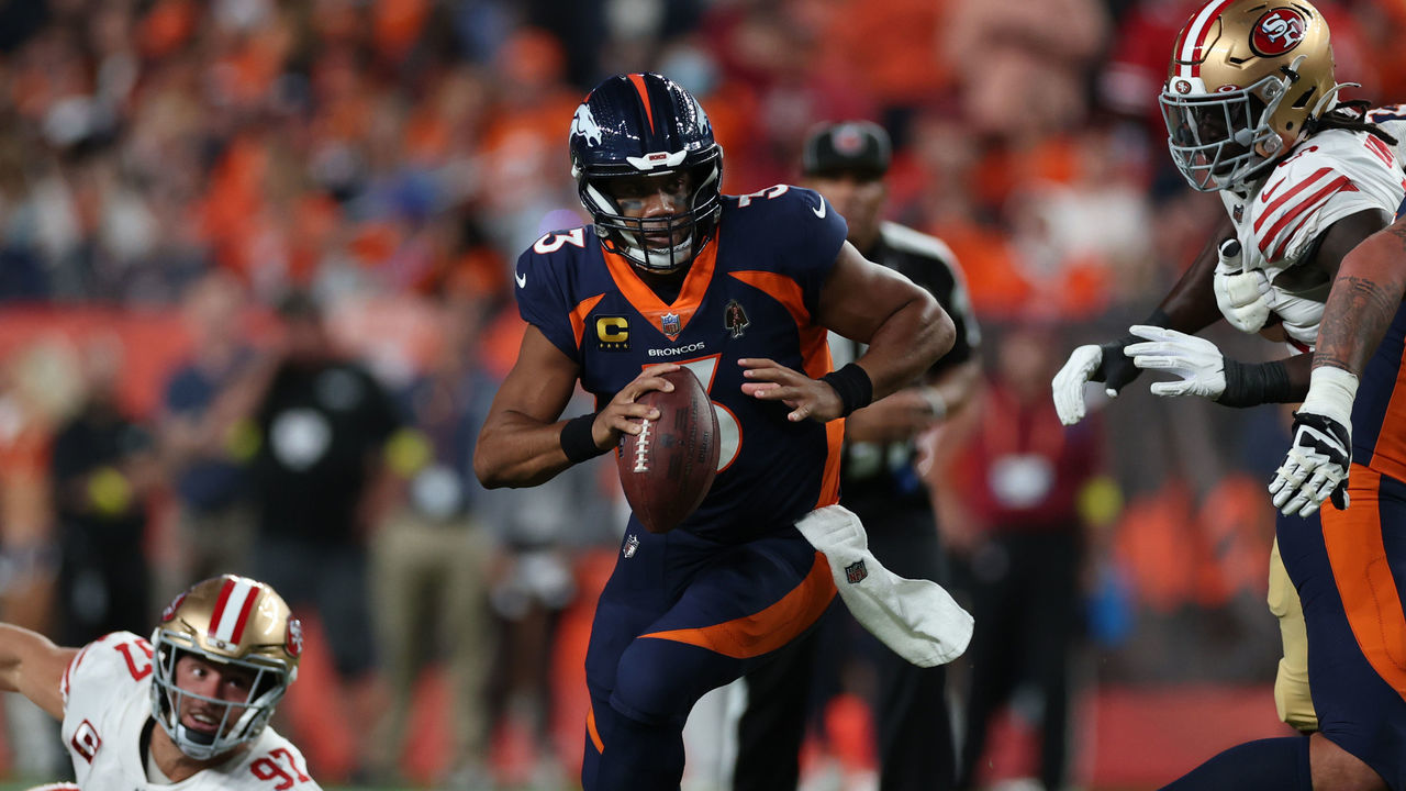DENVER, COLORADO - SEPTEMBER 25: Russell Wilson #3 of the Denver Broncos rushes during the first half against the San Francisco 49ers at Empower Field At Mile High on September 25, 2022 in Denver, Colorado.
