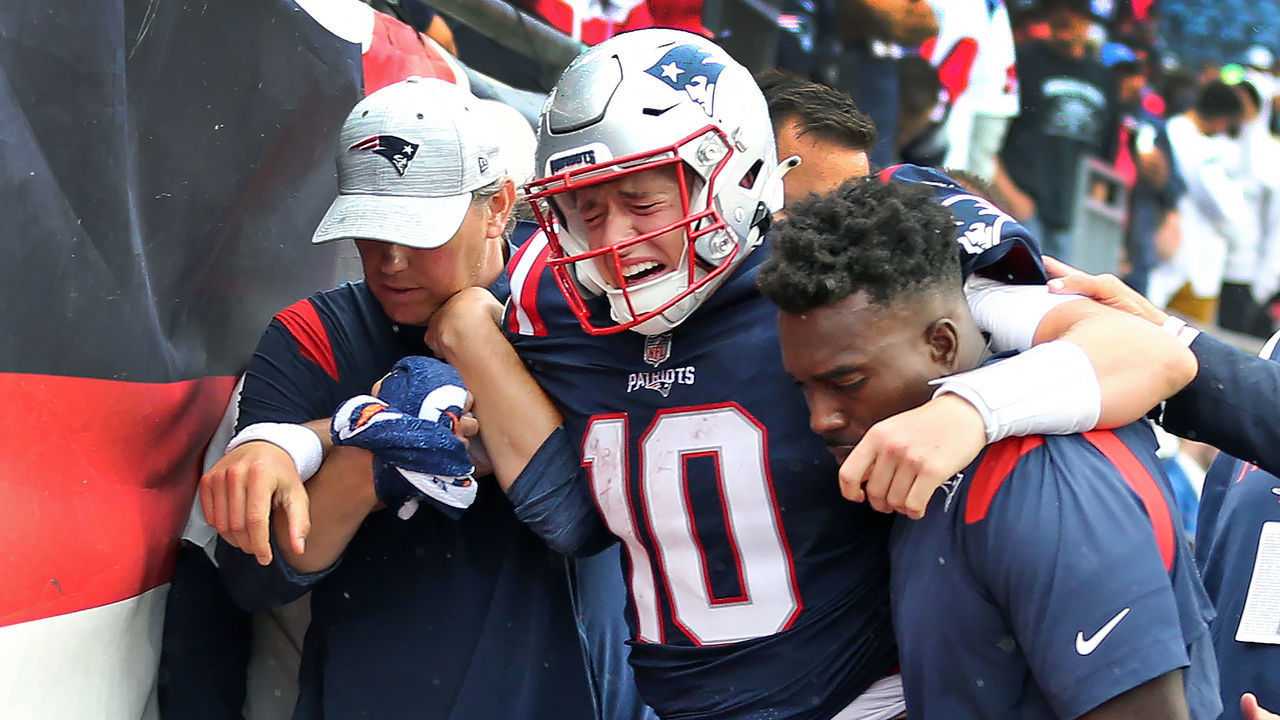 Foxborough, MA - September 25: New England Patriots quarterback Mac Jones was howling in pain as he was helped off the field and into the locker room after being injured late in the fourth quarter. The Patriots lost to the Baltimore Ravens, 37-26.