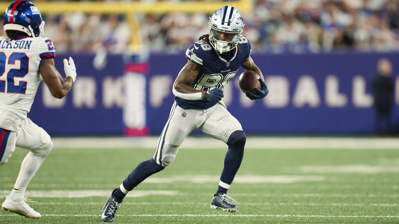 EAST RUTHERFORD, NJ - SEPTEMBER 26: CeeDee Lamb #88 of the Dallas Cowboys runs with the ball after a catch against the New York Giants at MetLife Stadium on September 26, 2022 in East Rutherford, New Jersey.