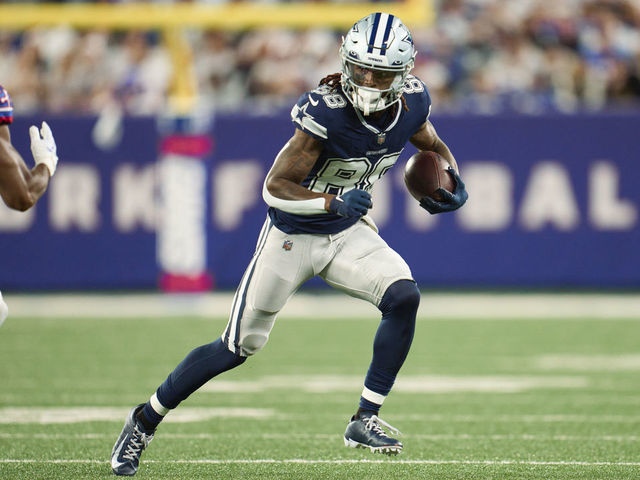 EAST RUTHERFORD, NJ - SEPTEMBER 26: CeeDee Lamb #88 of the Dallas Cowboys runs with the ball after a catch against the New York Giants at MetLife Stadium on September 26, 2022 in East Rutherford, New Jersey.
