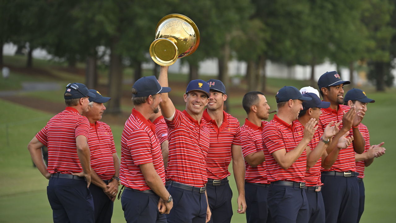 CHARLOTTE, NORTH CAROLINA - SEPTEMBER 25: The United States Team celebrates with the trophy after winning the Presidents Cup at Quail Hollow September 25, 2022, in Charlotte, North Carolina.