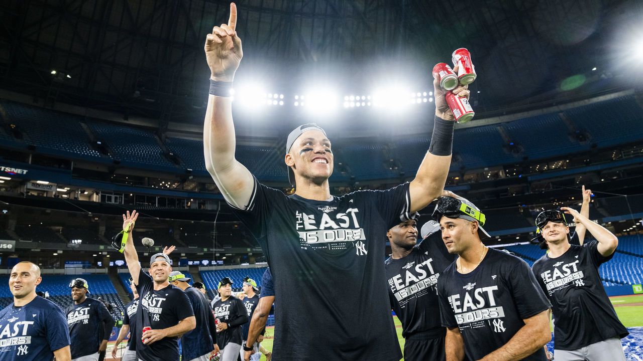 TORONTO, ON - SEPTEMBER 27: Aaron Judge #99 of the New York Yankees celebrates on the field after his team defeated the Toronto Blue Jays to clinch first place in the AL East following their MLB game at the Rogers Centre on September 27, 2022 in Toronto, Ontario, Canada.