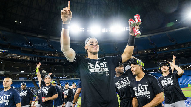 TORONTO, ON - SEPTEMBER 27: Aaron Judge #99 of the New York Yankees celebrates on the field after his team defeated the Toronto Blue Jays to clinch first place in the AL East following their MLB game at the Rogers Centre on September 27, 2022 in Toronto, Ontario, Canada.
