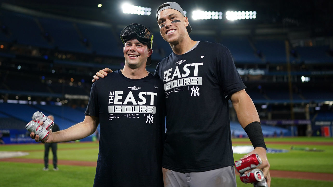 TORONTO, - SEPTEMBER 27: Aaron Judge #99 and Scott Effross #59 of the New York Yankees pose for a photo while celebrating becoming the 2022 AL East Division Champions after defeating the Toronto Blue Jays at Rogers Centre on Tuesday, September 27, 2022 in Toronto, Canada.
