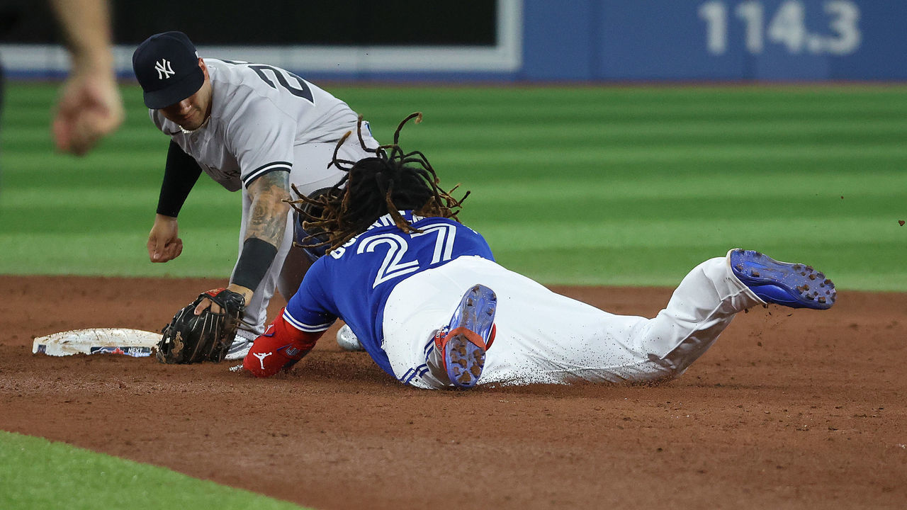 TORONTO, ON - SEPTEMBER 27 - Toronto Blue Jays first baseman Vladimir Guerrero Jr. (27) gets thrown out at second base as New York Yankees second baseman Gleyber Torres (25) waits for the tag as the Toronto Blue Jays fall to the New York Yankees 5-2 to clinch the AL East at Rogers Centre in Toronto. September 27, 2022. (Steve Russell/Toronto Star via Getty Images)