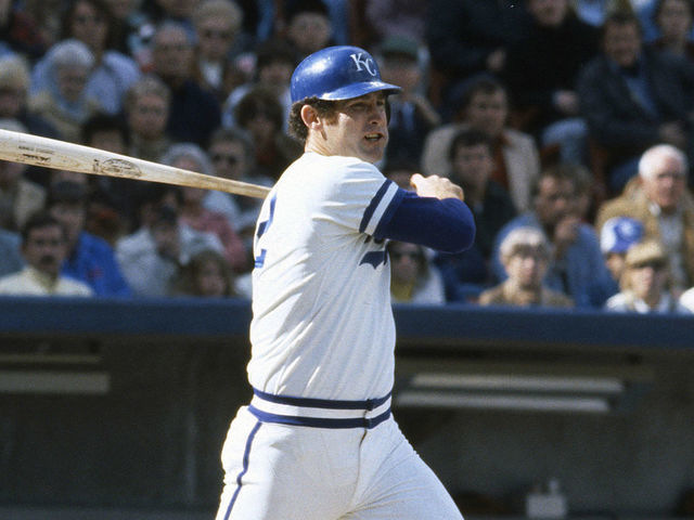 KANSAS CITY, MO - CIRCA 1977: John Wathan #12 of the Kansas City Royals bats against the New York Yankees during an Major League Baseball game circa 1977 at Royals Stadium in Kansas City, Missouri. Wathan played for the Royals from 1976-85.