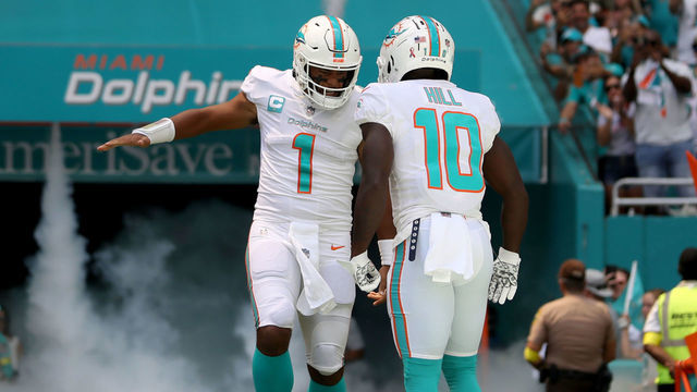 MIAMI GARDENS, FLORIDA - SEPTEMBER 11: Tua Tagovailoa #1 and Tyreek Hill #10 of the Miami Dolphins are introduced prior to playing the New England Patriots at Hard Rock Stadium on September 11, 2022 in Miami Gardens, Florida.
