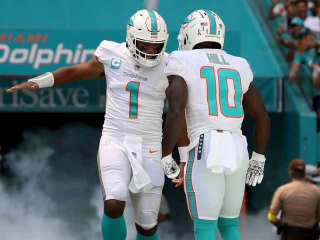 MIAMI GARDENS, FLORIDA - SEPTEMBER 11: Tua Tagovailoa #1 and Tyreek Hill #10 of the Miami Dolphins are introduced prior to playing the New England Patriots at Hard Rock Stadium on September 11, 2022 in Miami Gardens, Florida.