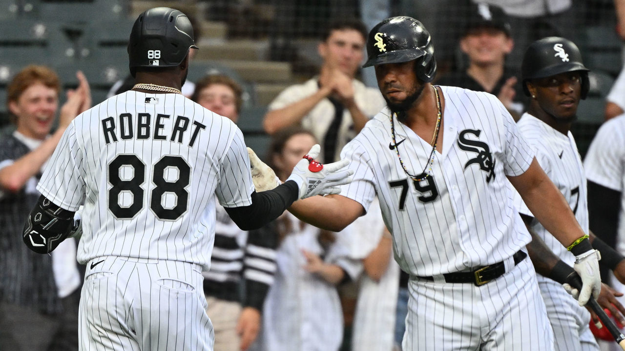 CHICAGO, IL - JULY 08: Luis Robert #88 of the Chicago White Sox is congratulated by teammate José Abreu #79 after hitting a two-run home run in the first inning against the Detroit Tigers at Guaranteed Rate Field on July 8, 2022 in Chicago, Illinois.