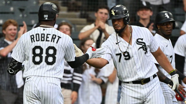 CHICAGO, IL - JULY 08: Luis Robert #88 of the Chicago White Sox is congratulated by teammate José Abreu #79 after hitting a two-run home run in the first inning against the Detroit Tigers at Guaranteed Rate Field on July 8, 2022 in Chicago, Illinois.