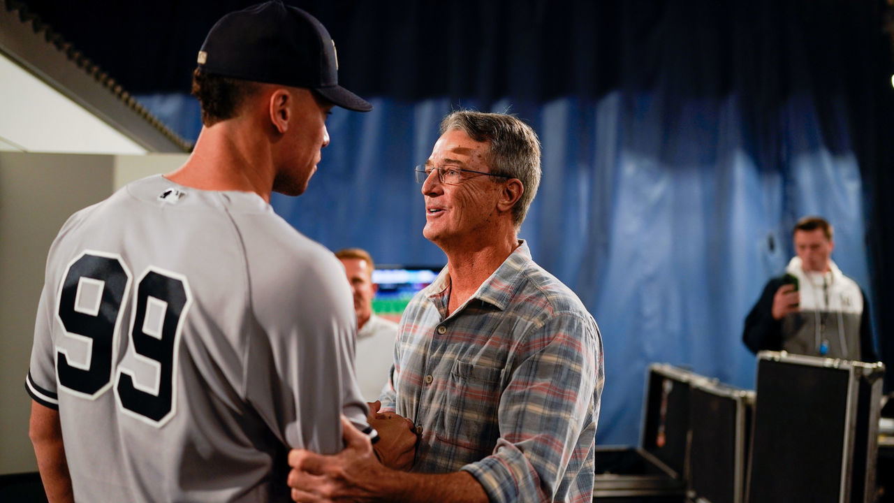 TORONTO, - SEPTEMBER 28: Aaron Judge #99 of the New York Yankees talks with Roger Maris Jr. after defeating the Toronto Blue Jays and tying Roger Maris AL home run record at Rogers Centre on Wednesday, September 28, 2022 in Toronto, Canada.
