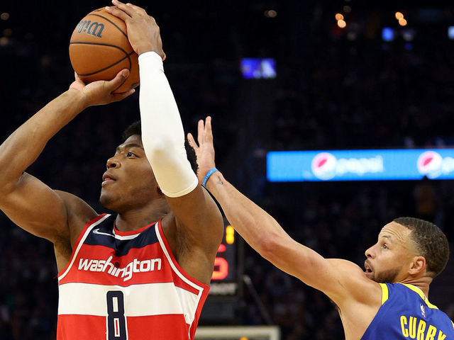 SAN FRANCISCO, CALIFORNIA - MARCH 14: Rui Hachimura #8 of the Washington Wizards shoots the ball while guarded by Stephen Curry #30 of the Golden State Warriors in the first half at Chase Center on March 14, 2022 in San Francisco, California. NOTE TO USER: User expressly acknowledges and agrees that, by downloading and/or using this photograph, User is consenting to the terms and conditions of the Getty Images License Agreement.