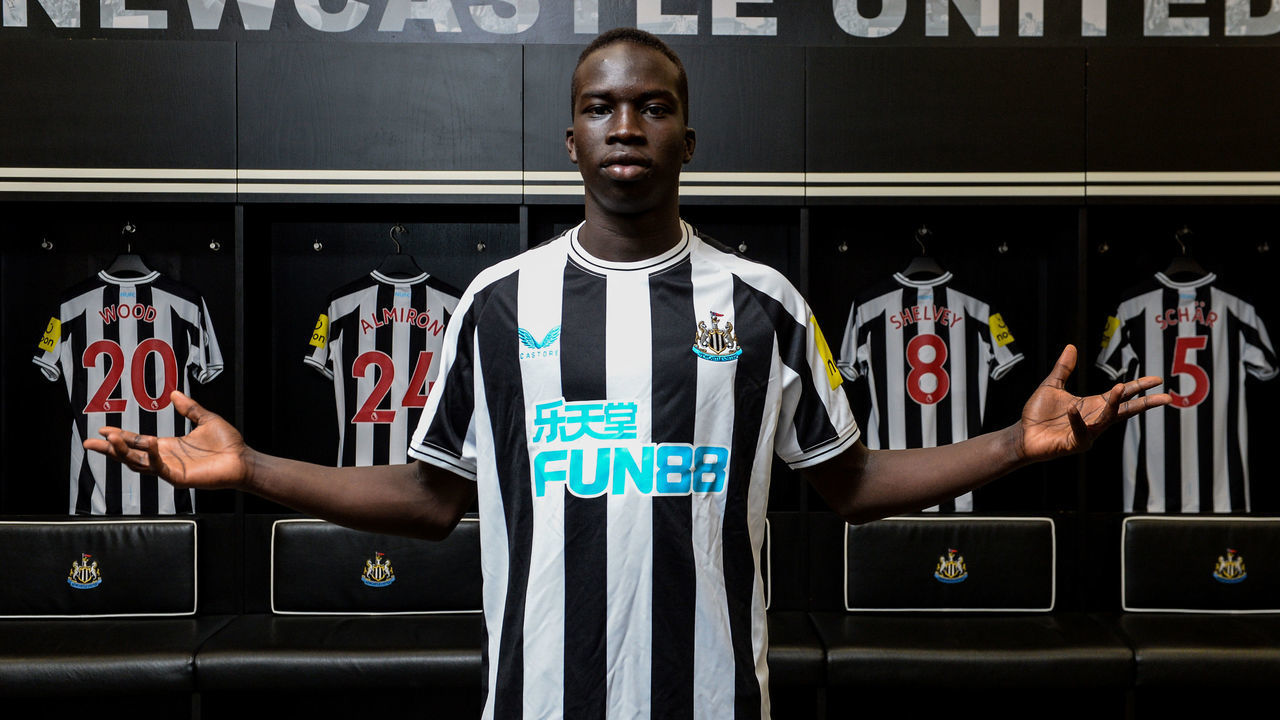 NEWCASTLE UPON TYNE, ENGLAND - SEPTEMBER 30: Garang Kuol poses for photographs in the dressing room at St.Jame's Park on September 30, 2022 in Newcastle upon Tyne, England.