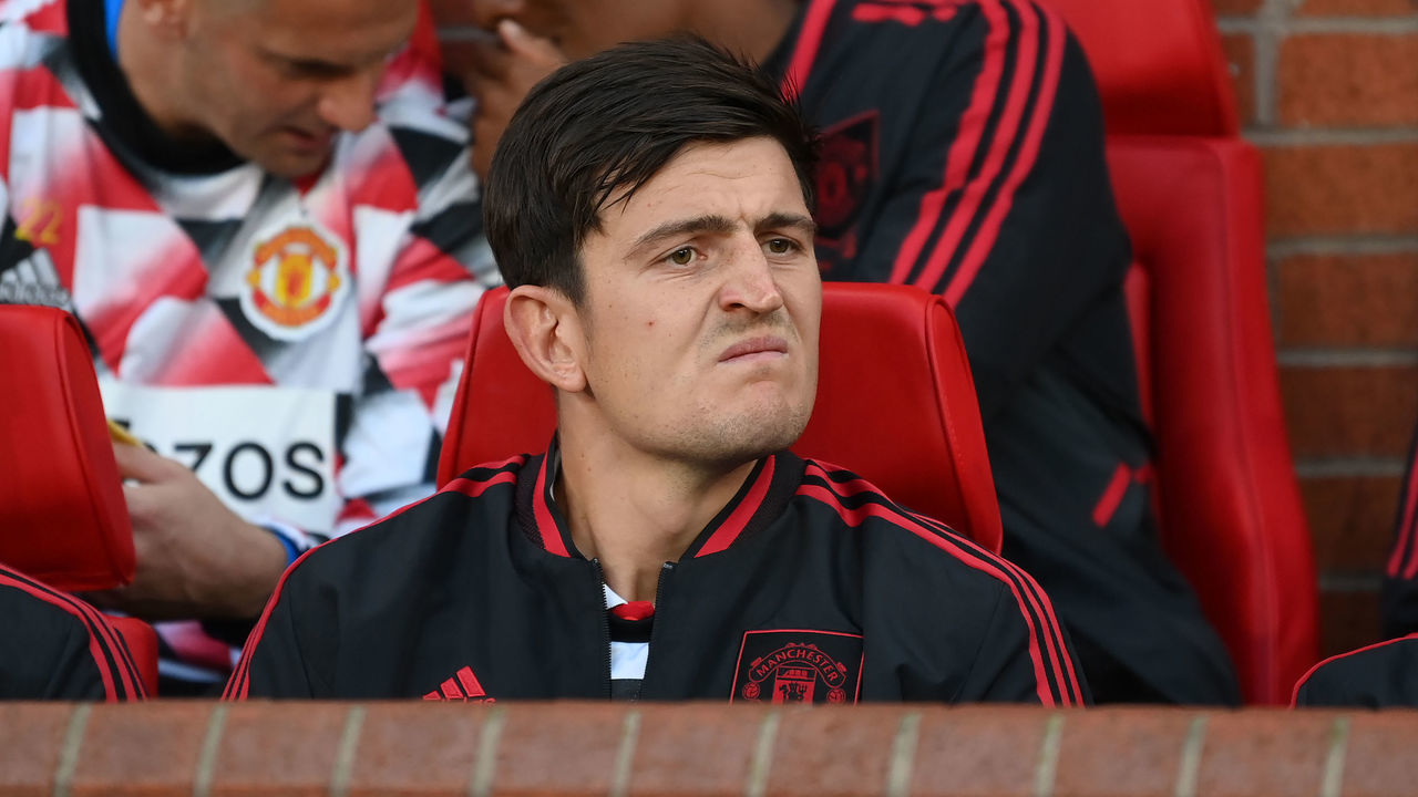 MANCHESTER, ENGLAND - AUGUST 22: Harry Maguire of Manchester United sits on the bench during the Premier League match between Manchester United and Liverpool FC at Old Trafford on August 22, 2022 in Manchester, England.