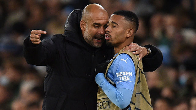 Manchester City's Spanish manager Pep Guardiola (L) speaks with Manchester City's Brazilian striker Gabriel Jesus (R) during the UEFA Champions League Group A football match between Manchester City and Paris Saint-Germain at the Etihad Stadium in Manchester, north west England, on November 24, 2021.