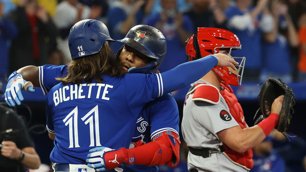 TORONTO, ON - SEPTEMBER 30 - Bo Bichette embraces Toronto Blue Jays first baseman Vladimir Guerrero Jr. (27) who hit a two run home run in the third inning as the Toronto Blue Jays play the Boston Red Sox at Rogers Centre in Toronto. September 30, 2022. Each year, in Canada, September 30 marks the National Day for Truth and Reconciliation. The day honours the children who never returned home and Survivors of residential schools, as well as their families and communities. (Steve Russell/Toronto Star via Getty Images)