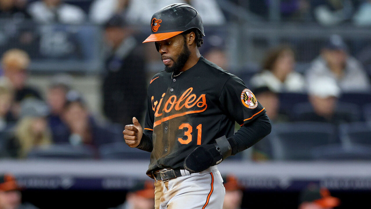 NEW YORK, NEW YORK - SEPTEMBER 30: Cedric Mullins #31 of the Baltimore Orioles scores a run in the first inning as Jose Trevino #39 of the New York Yankees looks at Yankee Stadium on September 30, 2022 in the Bronx borough of New York City.
