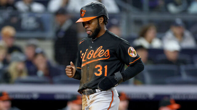 NEW YORK, NEW YORK - SEPTEMBER 30: Cedric Mullins #31 of the Baltimore Orioles scores a run in the first inning as Jose Trevino #39 of the New York Yankees looks at Yankee Stadium on September 30, 2022 in the Bronx borough of New York City.