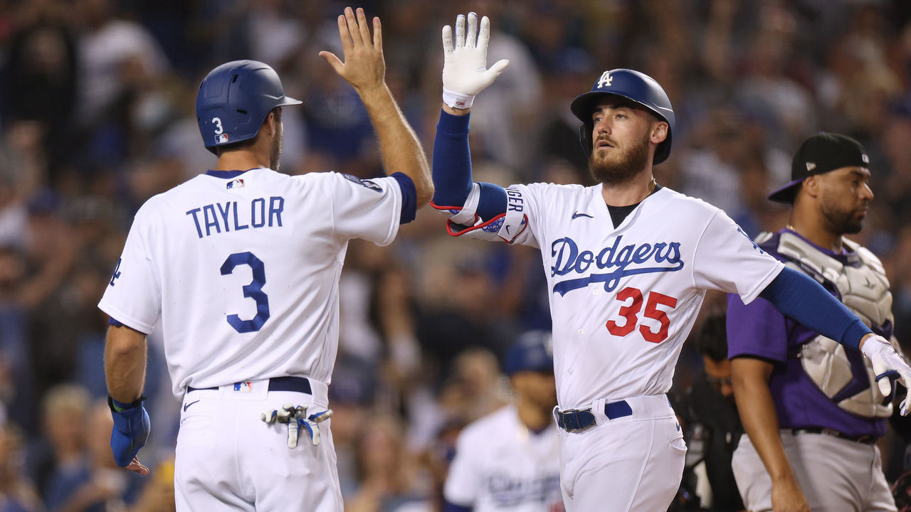 LOS ANGELES, CALIFORNIA - SEPTEMBER 30: Cody Bellinger #35 of the Los Angeles Dodgers celebrates his three run homerun with Chris Taylor #3 and Gavin Lux #9 in front of Elias Diaz #35 of the Colorado Rockies, to take a 4-0 lead, during the fourth inning at Dodger Stadium on September 30, 2022 in Los Angeles, California.