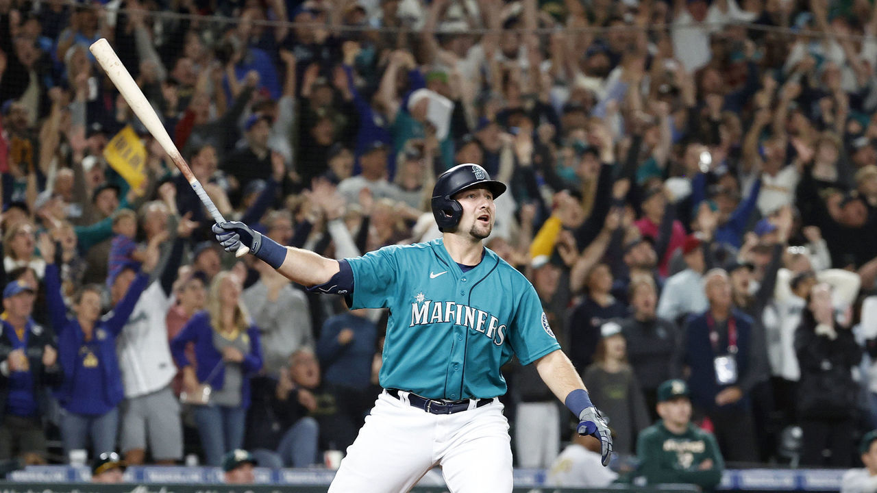 SEATTLE, WASHINGTON - SEPTEMBER 30: Cal Raleigh #29 of the Seattle Mariners celebrates his walk-off home run during the ninth inning against the Oakland Athletics at T-Mobile Park on September 30, 2022 in Seattle, Washington. With the win, the Seattle Mariners have clinched a postseason appearance for the first time in 21 years, the longest playoff drought in North American professional sports.