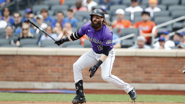 NEW YORK, NEW YORK - AUGUST 28: Charlie Blackmon #19 of the Colorado Rockies first inning base hit against the New York Mets at Citi Field on August 28, 2022 in New York City. The Rockies defeated the Mets 1-0.