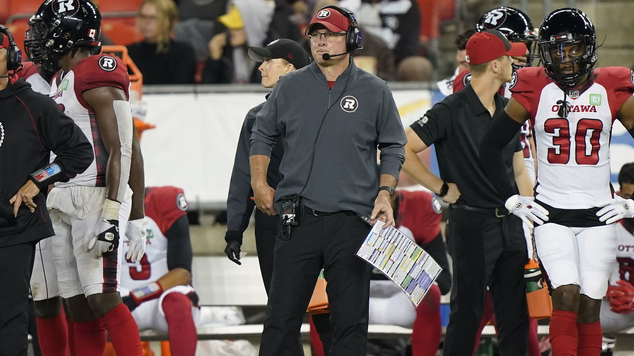 TORONTO, ON - OCTOBER 06: Head coach Paul LaPolice of the Ottawa Redblacks (center) on the sidelines against the Toronto Argonauts at BMO Field on October 6, 2021 in Toronto, Canada.