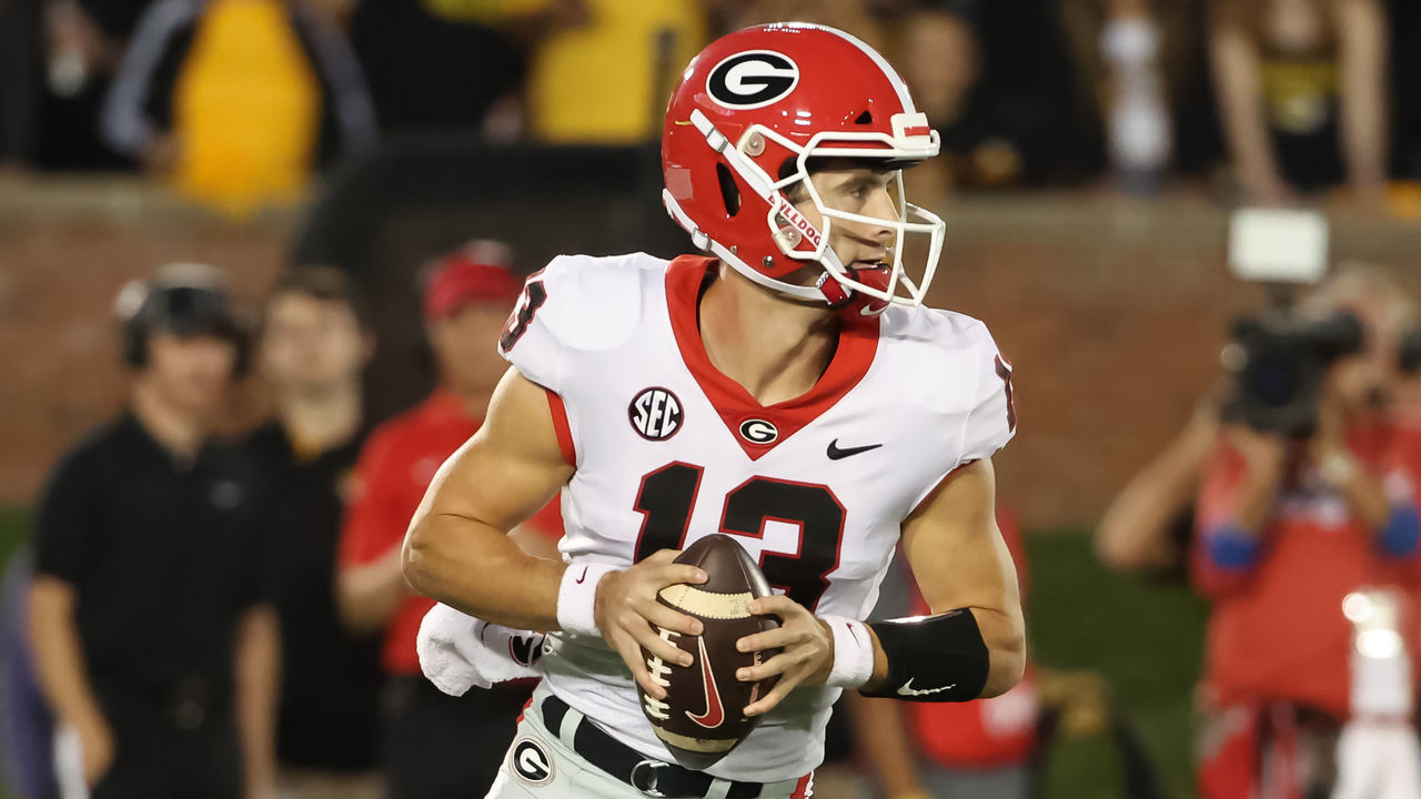 COLUMBIA, MO - OCTOBER 01: Georgia Bulldogs quarterback Stetson Bennett (13) rolls out looking to pass in the second quarter of an SEC game between the Georgia Bulldogs and Missouri Tigers on October 1, 2022 at Memorial Stadium at Faurot Field in Columbia, MO. Photo by Scott Winters/Icon Sportswire via Getty Images)