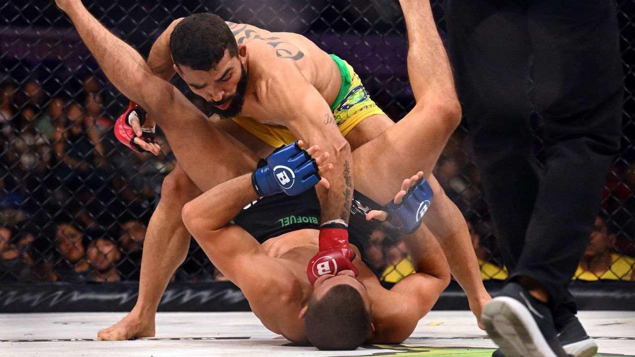 Long Beach, CA - October 01: Patricio Pitbull (red gloves) punches Adam Borics (blue gloves) during their Bellator Featherweight World Champion fight at Bellator 286: Pitbull vs. Borics at the Long Beach Arena Saturday, October 1, 2022. Pitbull defeated Borics via judges decision to retain his title.