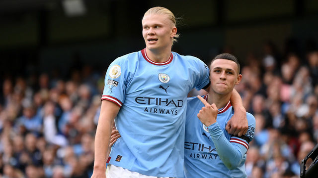 MANCHESTER, ENGLAND - OCTOBER 02: Phil Foden of Manchester City celebrates their sides sixth goal and their hat trick with team mate Erling Haaland during the Premier League match between Manchester City and Manchester United at Etihad Stadium on October 02, 2022 in Manchester, England.