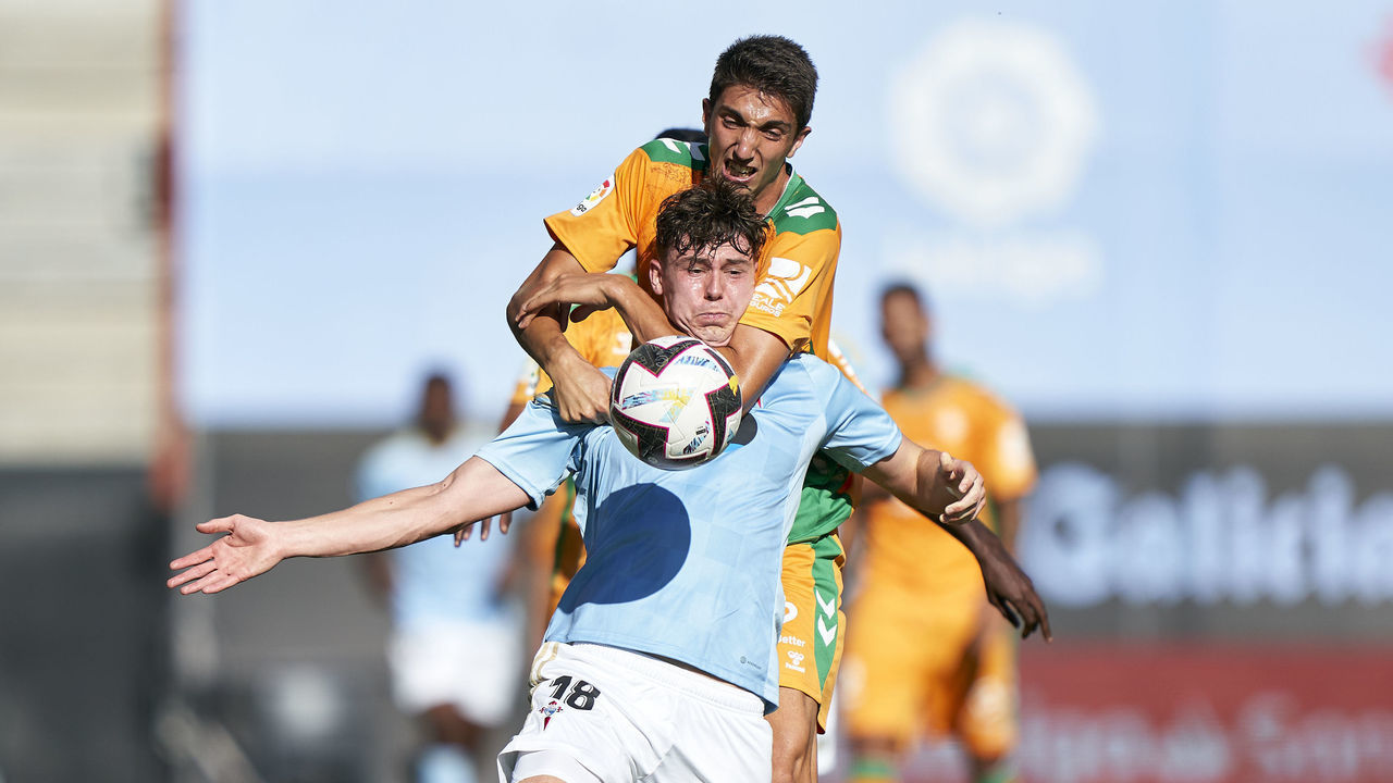 VIGO, SPAIN - OCTOBER 02: Edgar Gonzalez of Real Betis Balompie competes for the ball with Jorgen Strand Larsen of RC Celta de Vigo during the LaLiga Santander match between RC Celta de Vigo and Real Betis Balompie at Estadio Abanca Balaidos on October 02, 2022 in Vigo, Spain.