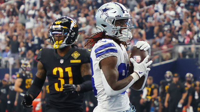 ARLINGTON, TEXAS - OCTOBER 02: CeeDee Lamb #88 of the Dallas Cowboys scores a touchdown during the fourth quarter against the Washington Commanders at AT&T Stadium on October 02, 2022 in Arlington, Texas.