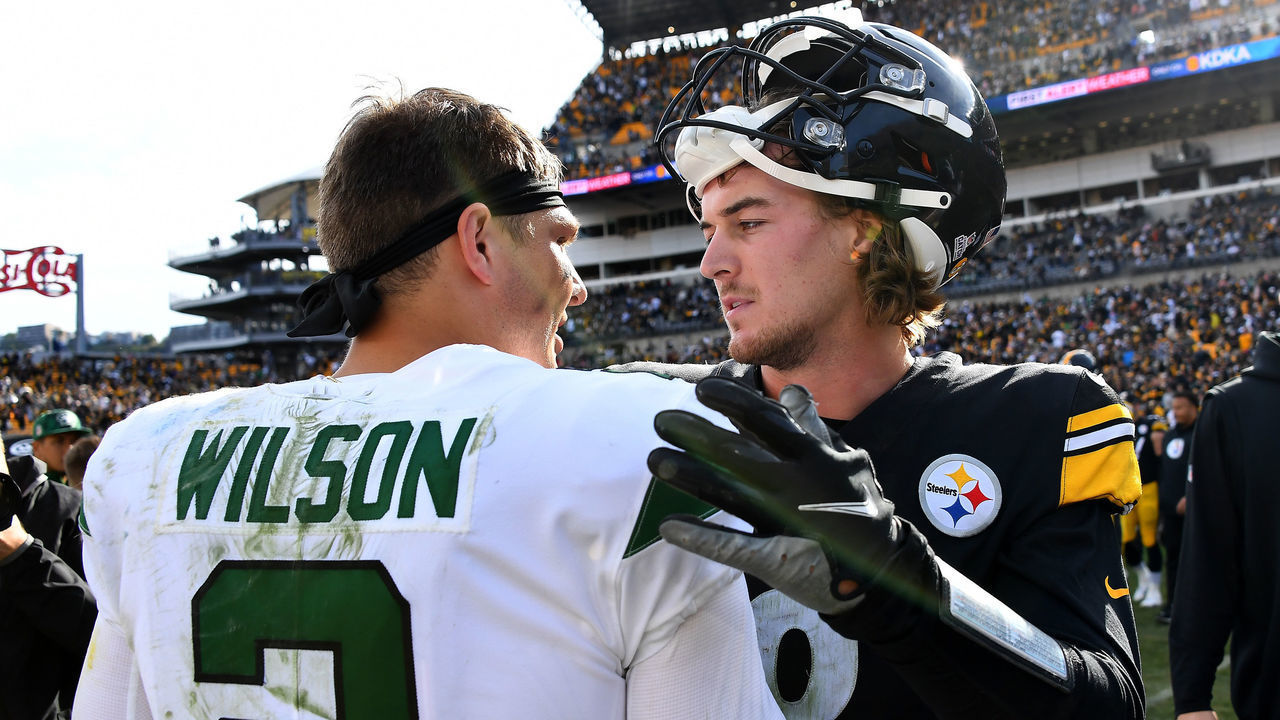 PITTSBURGH, PENNSYLVANIA - OCTOBER 02: Zach Wilson #2 of the New York Jets and Kenny Pickett #8 of the Pittsburgh Steelers meet after the Jets beat the Steelers 24-20 at Acrisure Stadium on October 02, 2022 in Pittsburgh, Pennsylvania.